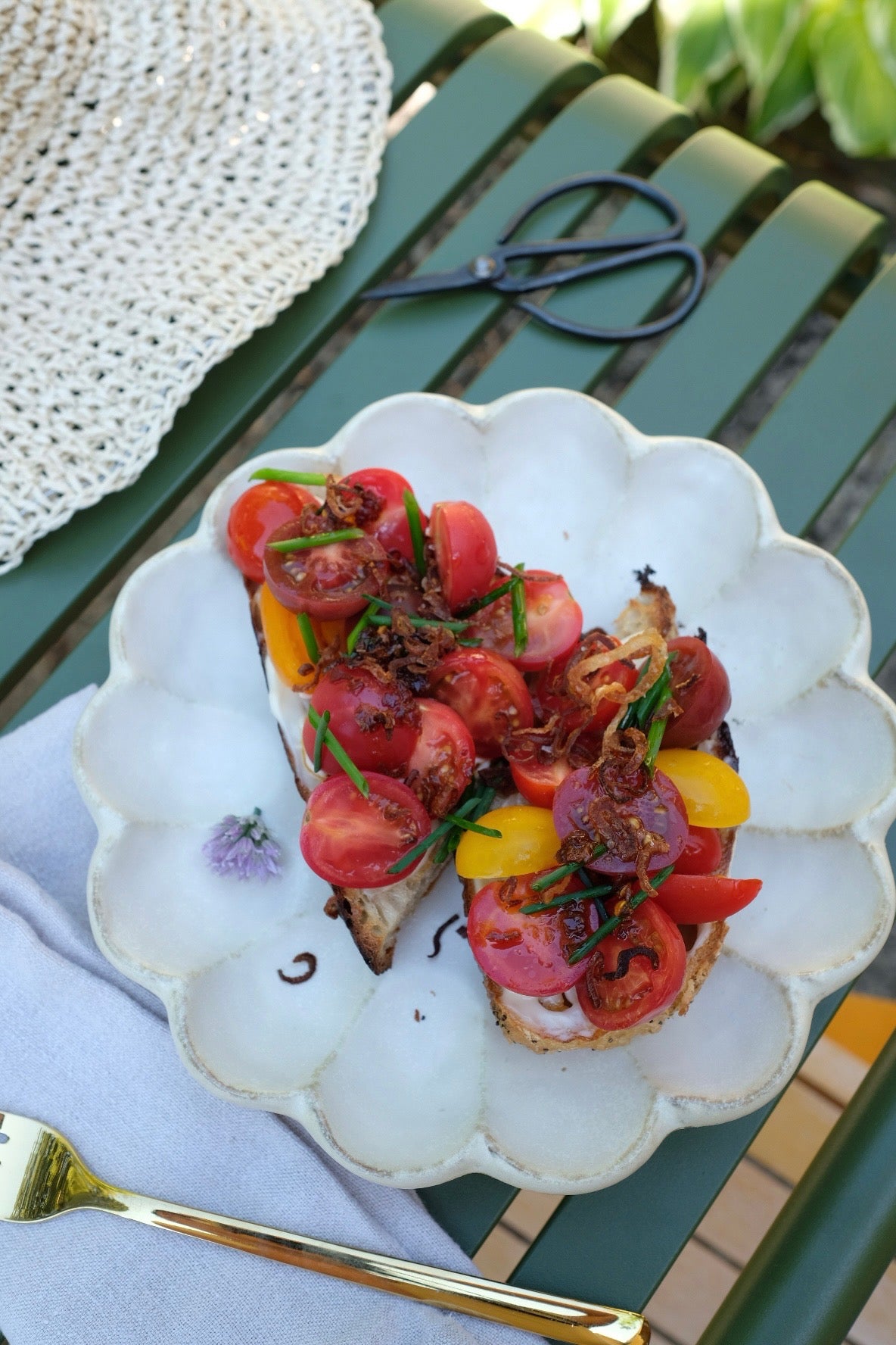 Plated dish of food on a decorative plate with a green outdoor background. Taken by Hazelfern Goods